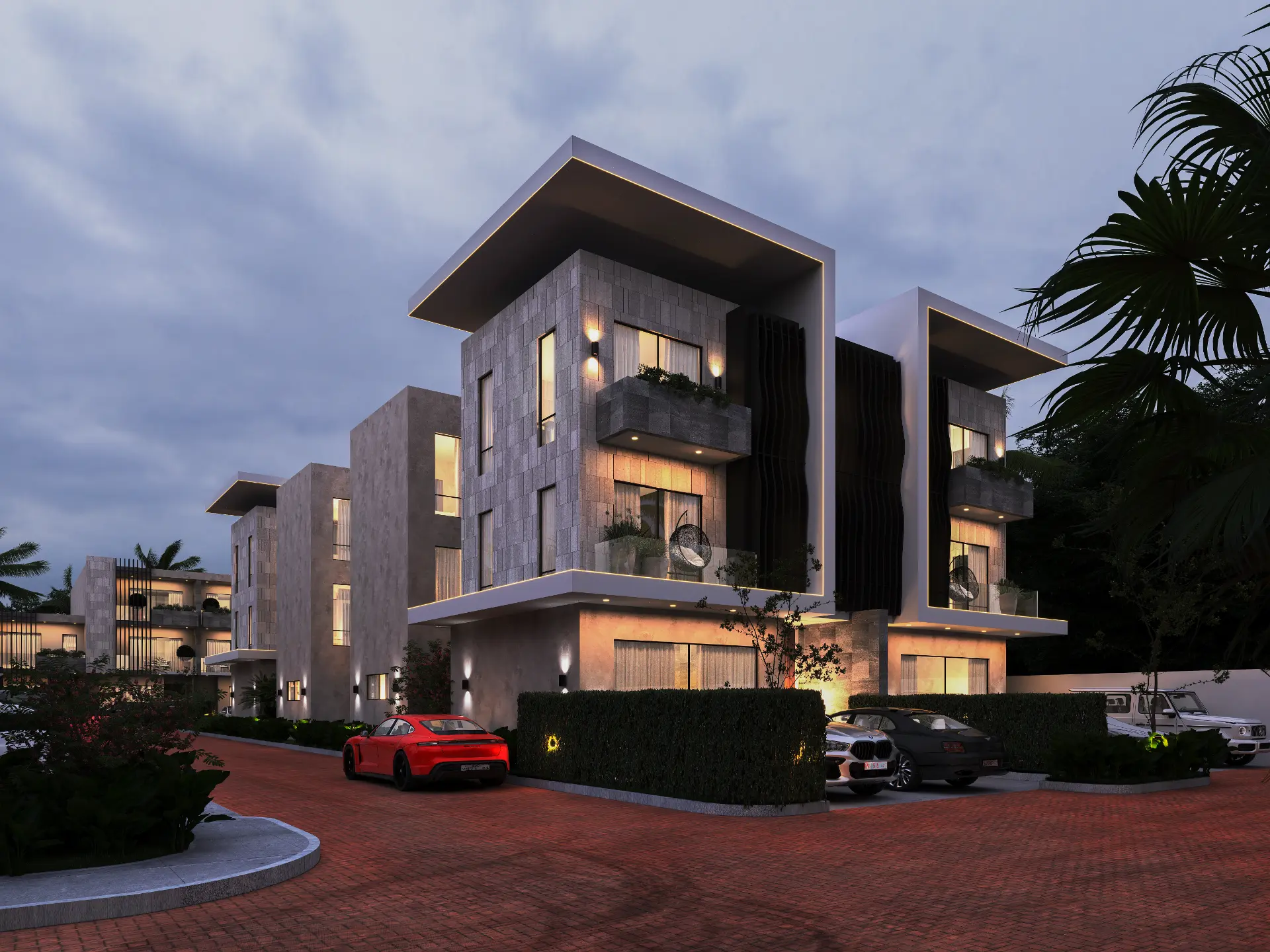Brickstone luxury residences at twilight with stone façades and warm lighting