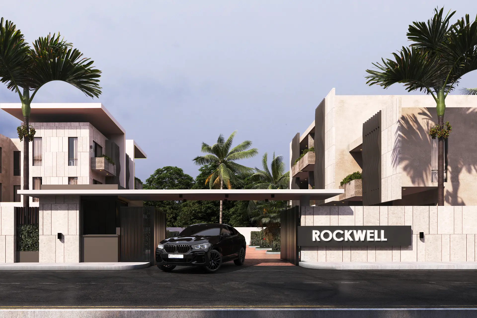 Rockwell gated entrance with signage and stone boundary wall
