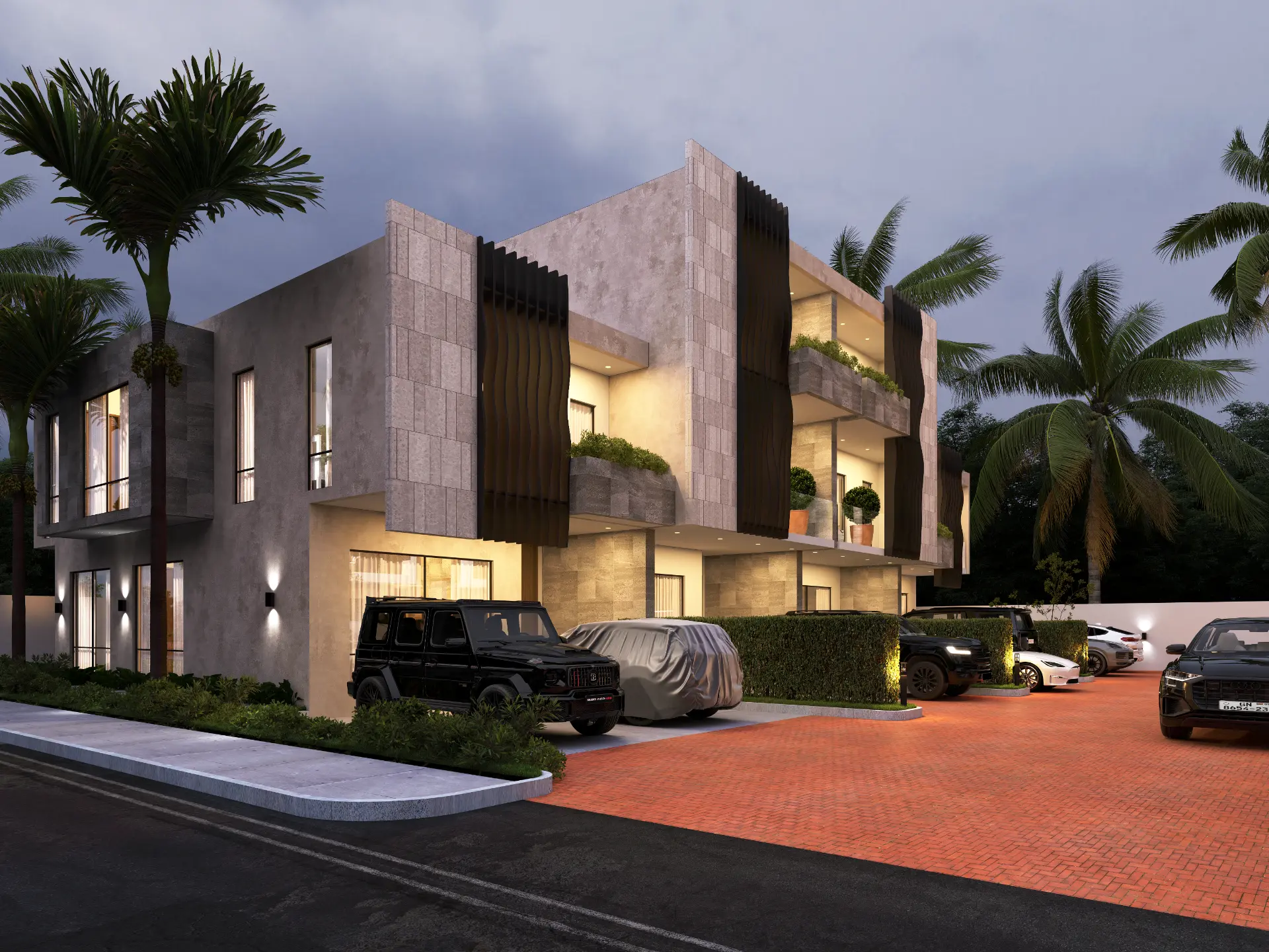 Rockwell residences at night with stone façade and sculpted fins